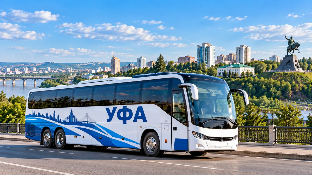 Пассажирский брендированный автобус Уфа на фоне города Уфа